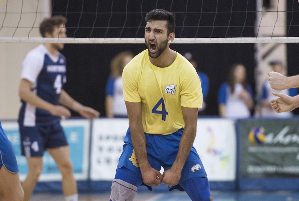 Irvan Brar in a yellow UBC #4 jersey celebrating a point at the net
